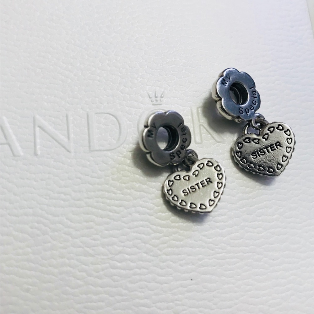 Two Authentic Pandora Sister Charms